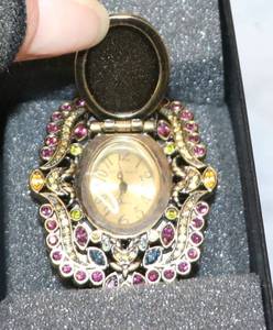 lot 150 image: Fashion Jewelry - 17 necklaces, 2 pin brooches, 1 cool watch - flip to face