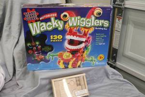 lot 143 image: NEW TOYS  (2) Wacky Wigglers & wooden puzzle
