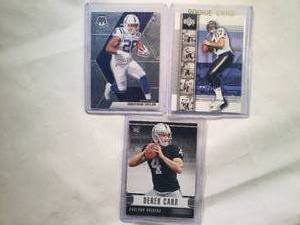 lot 186 image: Lot of 3 Rookies Jonathan Taylor 2020 Mosaic No. 216, Phillip RIvers 2004 Upper Deck No. 3, Derek Carr 2014 Rookies and Stars No. 131