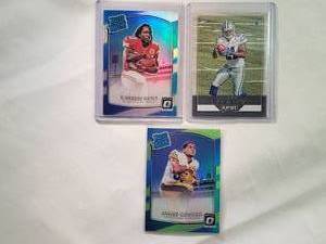 lot 187 image: Lot of 3 Rookies Kareem Hunt Rated Rookie No. 182, James Conner Rated Rookie Lime Prizm No. 172, Ezekiel Elliott Playoff No. 204
