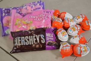 lot 121 image: Assorted Candy - Conversation Hearts, Chocolate Chips, Kinder Eggs