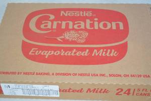 lot 181 image: Case of Nestle Carnation Evaporated Milk 24 5oz Cans