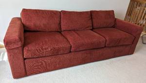 lot 9 image: Rust Colored Upholstered Sofa