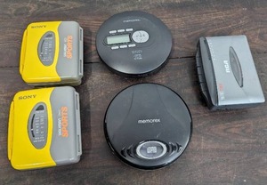 lot 149 image: 5 Vintage Portable Music Players