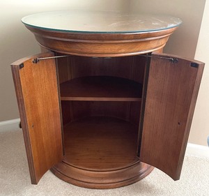 lot 8 image: Round Accent Table  Cabinet with Glass Top