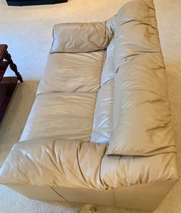 lot 55 image: Tan Leather Loveseat