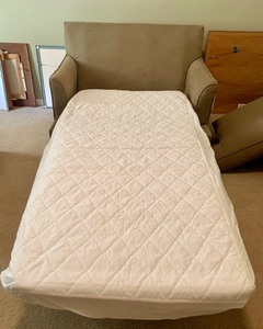 lot 59 image: Oversized Chair With Pullout Cot