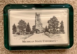lot 68 image: Michigan State Paperweight and Hand Carved Wood Figurine