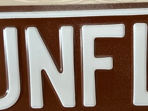 lot 34 image: Metal Gunflint Trail Sign