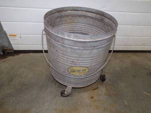 lot 101 image: Vintage Mop bucket on wheels
