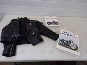 lot 121 image: Leather Kids Jacket and 2 Harley Davidson Books