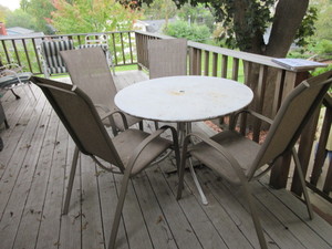 lot 579 image: PATIO TABLE AND FOUR CHAIRS