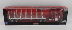 lot 22 image: New Ray 132 Scale Peterbilt Log Carrier Model 379 NIB