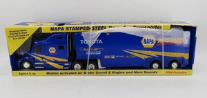 lot 29 image: First Gear Napa 2006 Exclusive Stamped Steel Race Car Transporter NIB