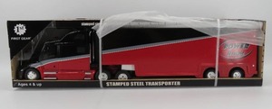 lot 30 image: First Gear Stamped Steel Power Hauling Transporter NIB