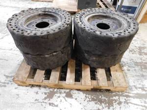 lot 36 image: 4 - Solid Skid Steer Wheels & Tires