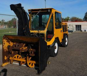 lot 34 image: Trackless MT5T 4wd Snow Blower with Heated Cab