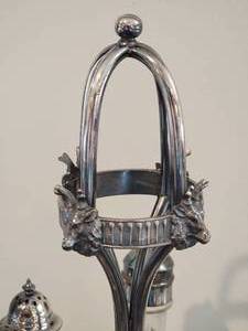 lot 90 image: Victorian Stag Head Silver Plate Six Bottle Cruet Set