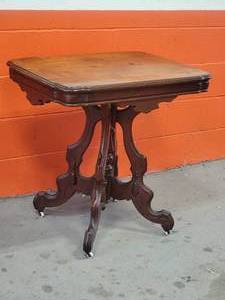 lot 73 image: Amazing Vintage Hand-Carved Accent Table with Ceramic Casters