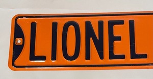 lot 10 image: Lionel Country Metal Sign