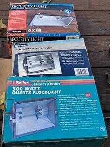 lot 958 image: Lot of (3) Outdoor Light Fixtures (in original packaging) - 300W Quartz Floodlight, 500W Quartz Light, 500W Security Light
