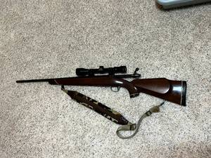 lot 157 image: Tikka M65 Mod 4601 30-06 with Redfield 3x-9x Scope