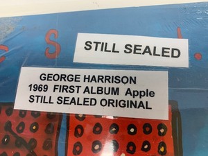 lot 19 image: George Harrison First Album Vinyl Record - Factory SEALED