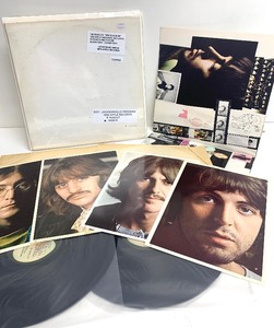 lot 22 image: The Beatles White Album Vinyl Record w Pictures and Poster