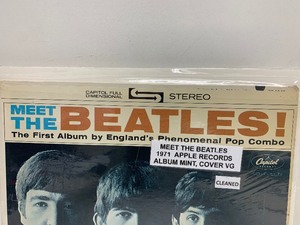 lot 77 image: The First Album by The Beatles Meet The Beatles Vinyl Record 