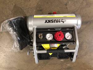 lot 5 image: Husky 1 Gal. Portable Electric-Powered Silent Air Compressor    Customer Returns See Pictures