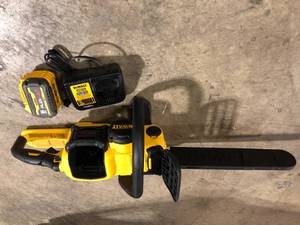 lot 23 image: DEWALT 60V MAX 16in. Brushless Battery Powered Chainsaw Kit with (1) FLEXVOLT 2Ah Battery & Charger  Customer Returns See Pictures
