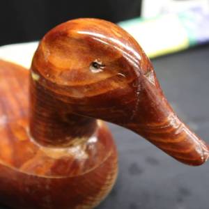 lot 33 image: CARVED WOODEN DUCK DECOY  FLAG