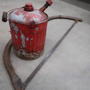 lot 106 image: VINTAGE HAND SAW WITH GAS CAN FOR YOUR CHAINSAW
