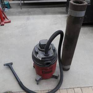lot 176 image: 6 GAL. SHOP VAC AND ROLL OF TAR PAPER.