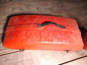 Plastic Homelite Chainsaw Box, 5-Gallon Plastic Gas Can, and a One Gallon Gas Can