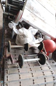 Pallet Containing an All Rubber Snowmobile Track, Bogie Wheels, a Snowmobile Clutch Assembly, a Home-Made Dolly, and an Our Own Hard