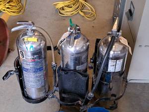lot 1117 image: Lot of (3) J.N. Johnson Paper-Wood-Cloth Class A Fire Extinguishers (empty) with Wall Mount Brackets
