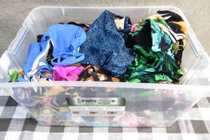 lot 197 image: 10 x 15 x 21 Bin Filled with Womens Tops and Bottoms Swim Suites