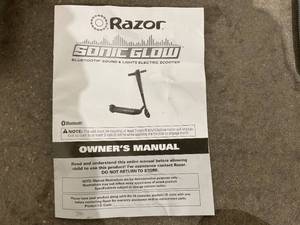 lot 61 image: Razor Sonic Glow Black Electric Scooter with LED Lights and Bluetooth Wireless Speaker - READ