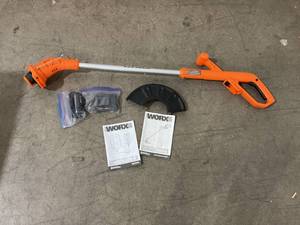 lot 99 image: Worx 20V PowerShare 10 Cordless String Trimmer & Edger with Battery & Charger
