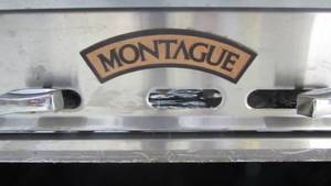 lot 99 image: Montague 4 Burner Stove With Caster Wheels