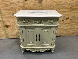 lot 17 image: HOME DECORATORS COLLECTION Winslow 33 in. W x 22 in. D x 35 in. H Single Sink Freestanding Bath Vanity in Antique White with White Marble Top