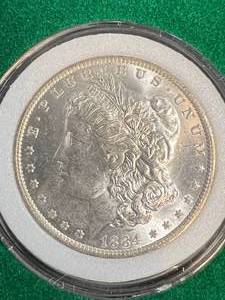 1884-O US MORGAN SILVER DOLLAR IN AIRTITE