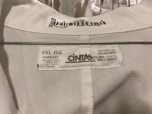 lot 65 image: Rack of White Cintas Lab Coats, Various sizes medium to 3XL