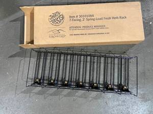 lot 29 image: Lot of grocery supplies twist ties and spring load racks