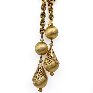 lot 35 image: VINTAGE Monet Rope Yellow Base Metal Bolero Lariat Necklace. Circa 1961 Bolero Collection