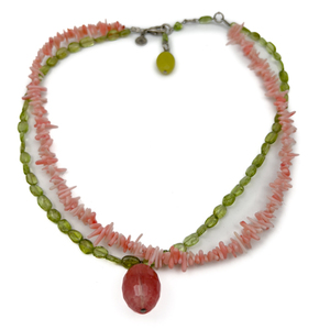 lot 92 image: David Aubrey, Pink Coral and Peridot White Base Metal Bead Necklace. Pink Oval Bead Center.