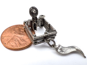lot 73 image: Dont fence me in , Pacific Jewelry Co Sterling Silver Charm. Mechanical - Opens Up. 