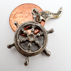 lot 78 image: Ship Captains wheel, Pacific Jewelry Co California Sterling Silver Charm.