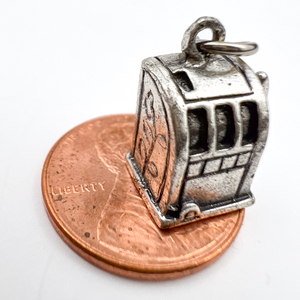 lot 79 image: Slot machine, Unknown Maker, Sterling Silver Charm.